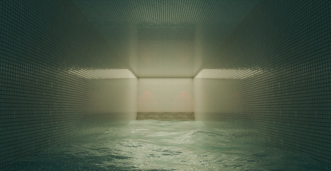 Standing water covering the floor of a damaged room